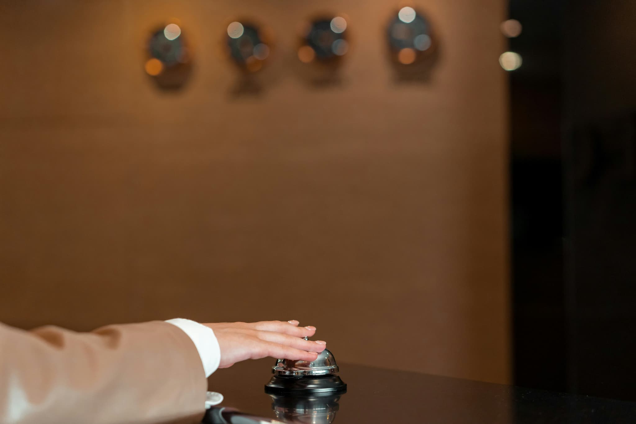 Concierge greeting a visitor in a hotel lobby
