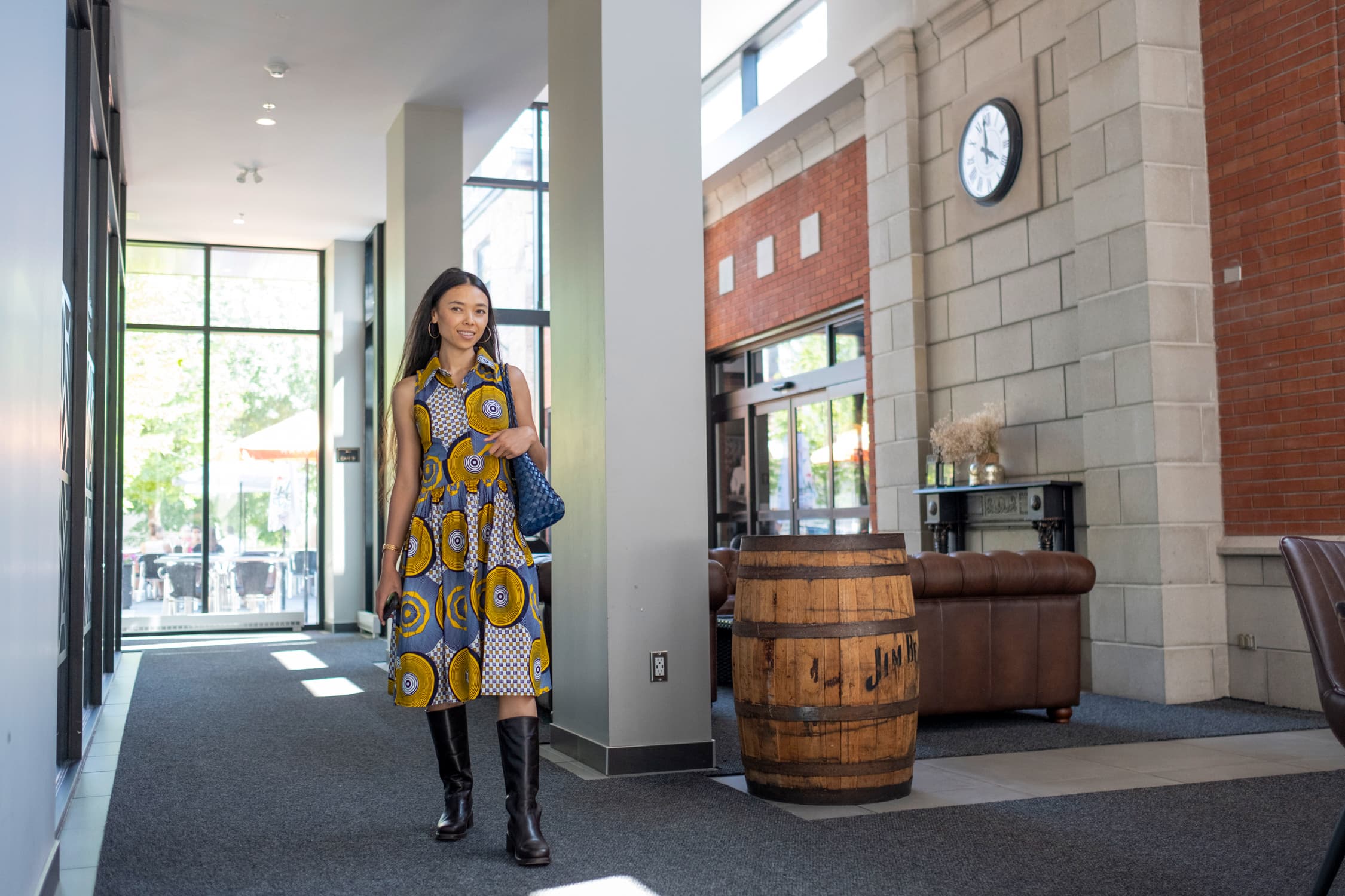 A resident walking through the lobby of the British Square